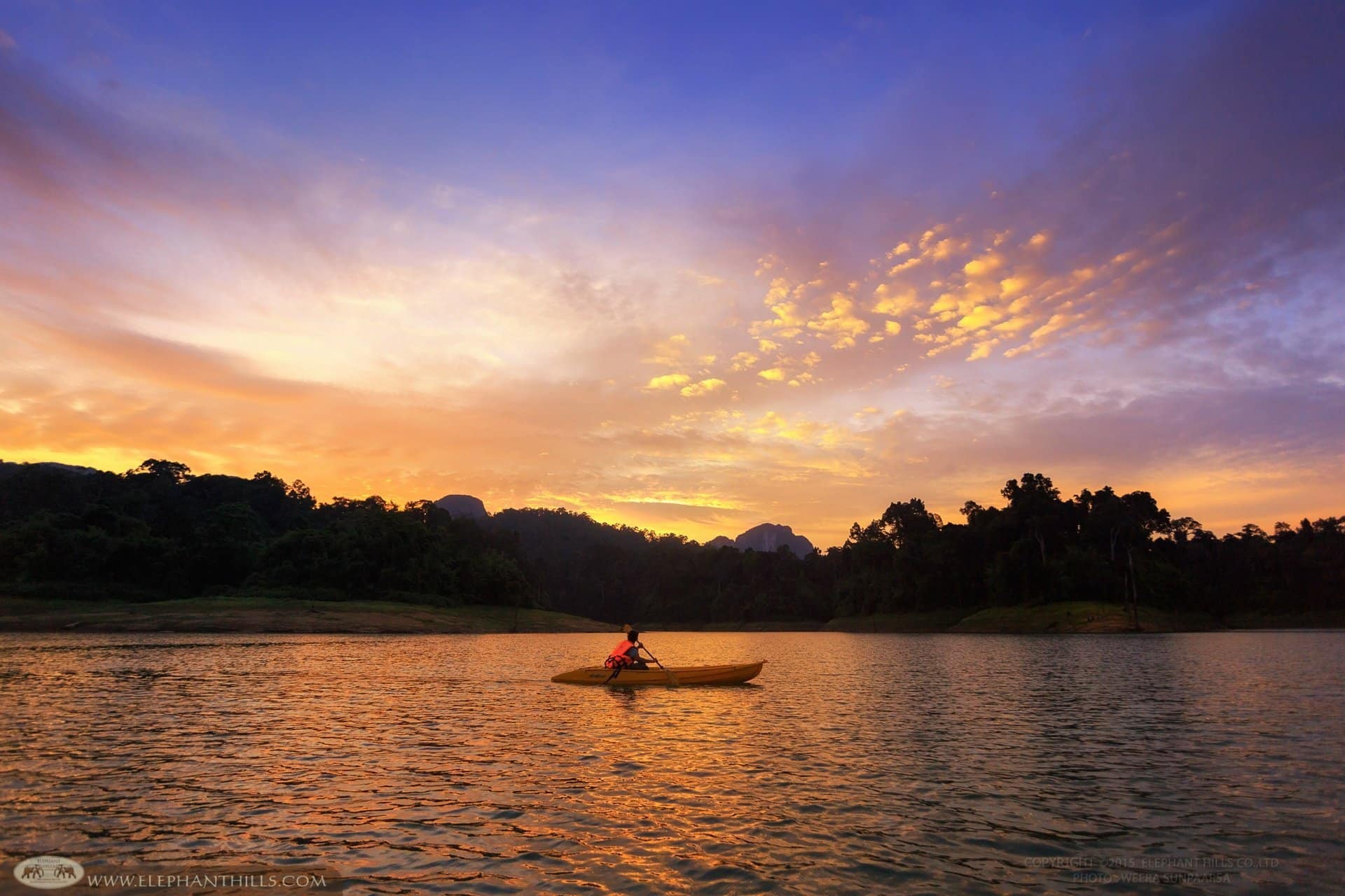 Activities in Khao Sok National Park include kayaking down the river and enjoying breathtaking rainforest views