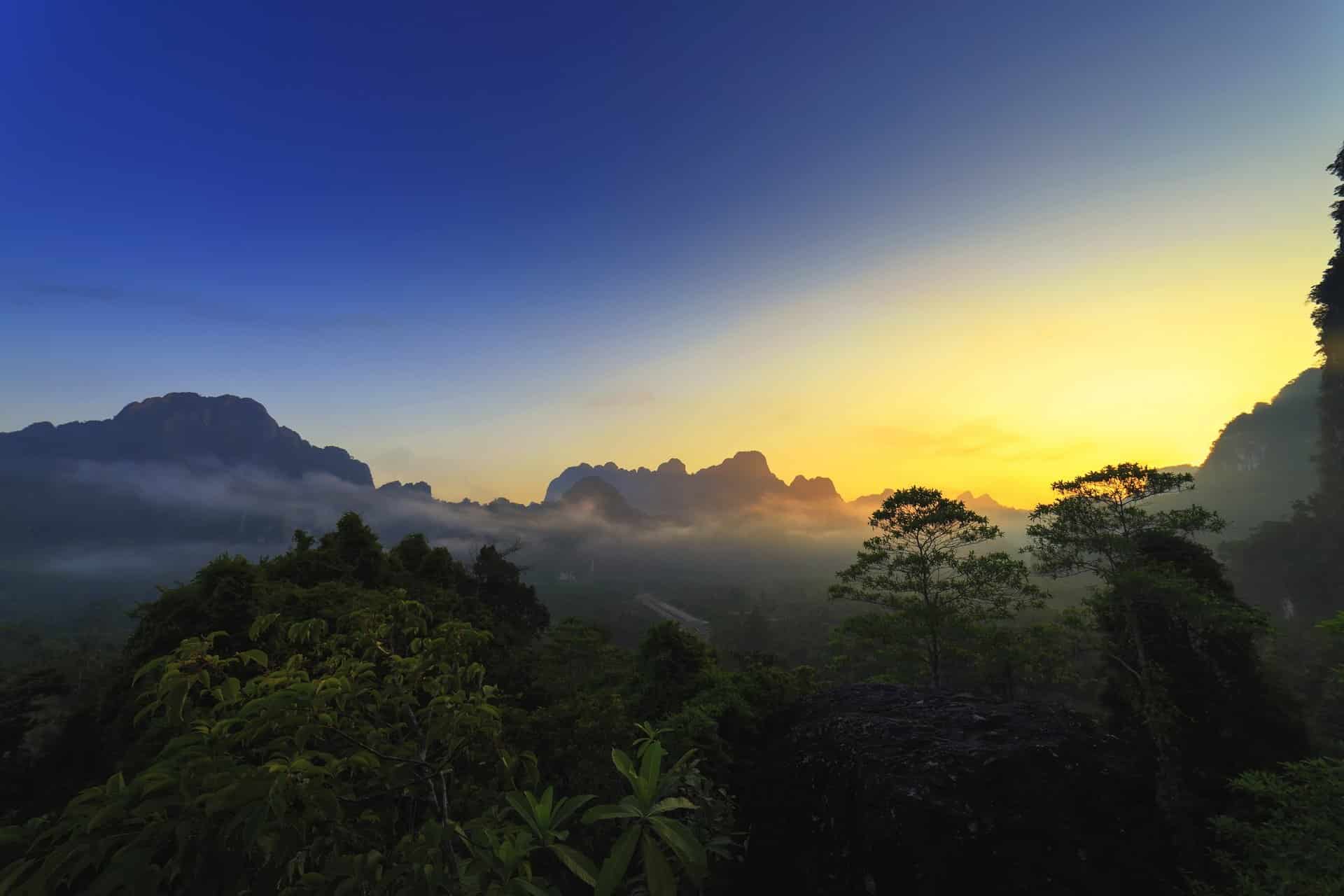 Sunrise over the rainforest in Khao Sok National Park, Thailand.